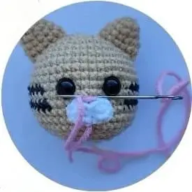 Embroidering a nose Embroidering a nose